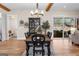 Inviting dining room with wood beams, chandelier, and sliding glass doors to outdoor living area at 0 Pinegate Way, Sharpsburg, GA 30277