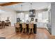 Modern kitchen with a center island, stainless steel appliances, and sleek pendant lighting at 0 Pinegate Way, Sharpsburg, GA 30277