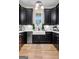 Kitchen with black cabinets, stainless steel appliances, white countertop and modern sink at 0 Pinegate Way, Sharpsburg, GA 30277