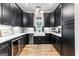 Kitchen with black cabinets, stainless steel appliances, white countertop and modern sink at 0 Pinegate Way, Sharpsburg, GA 30277