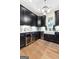 Kitchen with black cabinets, stainless steel appliances, white countertop and modern sink at 0 Pinegate Way, Sharpsburg, GA 30277