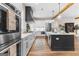 Modern kitchen showcasing white cabinets, stainless steel appliances, and a functional island at 0 Pinegate Way, Sharpsburg, GA 30277