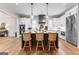 Stylish kitchen featuring an island, stainless steel appliances, and modern pendant lights at 0 Pinegate Way, Sharpsburg, GA 30277