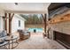 Covered patio with a fireplace, ceiling fan, and a view of the pool at 0 Pinegate Way, Sharpsburg, GA 30277