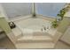 Luxurious bathroom with a large corner jacuzzi tub at 3443 Pinemont Dr, Douglasville, GA 30135