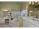 Elegant bathroom featuring double vanities and a soaking tub at 3443 Pinemont Dr, Douglasville, GA 30135