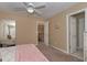 Bright bedroom with a king-size bed, and access to a hallway at 3443 Pinemont Dr, Douglasville, GA 30135