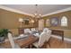 Formal dining room with hardwood floors, chandelier and decorative wall art at 3443 Pinemont Dr, Douglasville, GA 30135