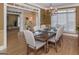 Formal dining room with hardwood floors, chandelier, and large windows at 3443 Pinemont Dr, Douglasville, GA 30135