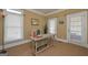 Home office with French doors, hardwood floors and neutral wall colors at 3443 Pinemont Dr, Douglasville, GA 30135