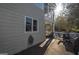 Gray siding home exterior showcasing a deck and screened porch at 3443 Pinemont Dr, Douglasville, GA 30135