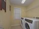 Convenient laundry room with washer, dryer, and shelving at 3443 Pinemont Dr, Douglasville, GA 30135