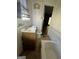 Small bathroom with a vanity, toilet, and bathtub at 1093 Smith Sw St, Atlanta, GA 30310