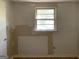 Unfinished bedroom with window and wood floors at 200 Eleanor Dr, Covington, GA 30016