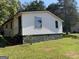 White single-story house with steps and small yard at 200 Eleanor Dr, Covington, GA 30016