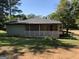 House with green siding and screened porch at 200 Eleanor Dr, Covington, GA 30016