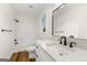 Modern bathroom with white vanity and a shower/tub combo at 2473 Baker Nw Rd, Atlanta, GA 30318