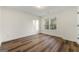 Bright bedroom with hardwood floors and large window at 2473 Baker Nw Rd, Atlanta, GA 30318