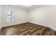 Bright bedroom with hardwood floors and large window at 2473 Baker Nw Rd, Atlanta, GA 30318