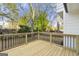 Wooden deck with black railing overlooking backyard at 2473 Baker Nw Rd, Atlanta, GA 30318