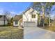 Charming two-story house with a white exterior, two-car garage, and manicured lawn at 2473 Baker Nw Rd, Atlanta, GA 30318