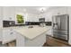 Spacious kitchen with white cabinets, quartz countertops, and stainless steel appliances at 2473 Baker Nw Rd, Atlanta, GA 30318