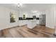 Modern kitchen with white cabinets, quartz countertops, and stainless steel appliances at 2473 Baker Nw Rd, Atlanta, GA 30318