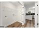 Laundry room with shelving and access to the kitchen at 2473 Baker Nw Rd, Atlanta, GA 30318