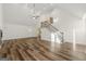 Open living room with high ceilings, hardwood floors, and a staircase at 2473 Baker Nw Rd, Atlanta, GA 30318