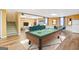 Finished basement with pool table, seating area, and stairs at 180 Rock Hill Dr, Fayetteville, GA 30215