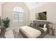 Bedroom with king-size bed and arched window at 180 Rock Hill Dr, Fayetteville, GA 30215