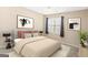 Bright bedroom with a queen-size bed and window at 180 Rock Hill Dr, Fayetteville, GA 30215