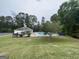 Community pool and clubhouse with grassy area at 180 Rock Hill Dr, Fayetteville, GA 30215