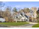 Two-story house with green shutters, a driveway and a spacious yard at 180 Rock Hill Dr, Fayetteville, GA 30215