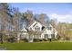 Two-story house with green shutters and landscaping at 180 Rock Hill Dr, Fayetteville, GA 30215