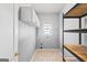 Laundry room with washer/dryer hookups and shelving at 180 Rock Hill Dr, Fayetteville, GA 30215