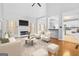 Spacious living room with hardwood floors and a fireplace at 180 Rock Hill Dr, Fayetteville, GA 30215
