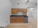 Small kitchenette with wood cabinets and mini-fridge at 234 Hampton Shores Dr, Hampton, GA 30228