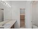 Bathroom with a vanity, toilet, and access to shelving at 360 Kaleb C, Mcdonough, GA 30252