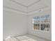Well-lit bedroom with large window and hardwood floor at 360 Kaleb C, Mcdonough, GA 30252