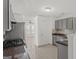 Gray kitchen cabinets, granite countertops, and stainless steel appliances at 360 Kaleb C, Mcdonough, GA 30252
