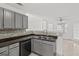 Kitchen with gray cabinets, granite counters, and tile floors at 360 Kaleb C, Mcdonough, GA 30252