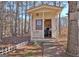 Charming backyard shed with a porch, ideal for storage or a workshop at 141 Dodgen Place Dr, Hampton, GA 30228