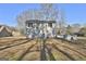 Rear view of house with detached storage shed at 201 Ball St, Moreland, GA 30259