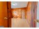 Bright bedroom with wood paneled walls and light brown laminate flooring at 4487 Berkshire Rd, Forest Park, GA 30297