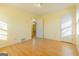 Bedroom with hardwood floors and access to another room at 4487 Berkshire Rd, Forest Park, GA 30297