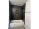 Clean bathroom with dark tile shower and white bathtub at 145 Dockside Dr # 396, Fayetteville, GA 30215