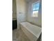 Bathroom with free-standing tub and marble floor at 145 Dockside Dr # 396, Fayetteville, GA 30215