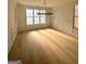 Bright dining room with hardwood floors, large windows, and elegant chandelier at 145 Dockside Dr # 396, Fayetteville, GA 30215