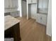 Kitchen features light hardwood floors and a large pantry at 145 Dockside Dr # 396, Fayetteville, GA 30215